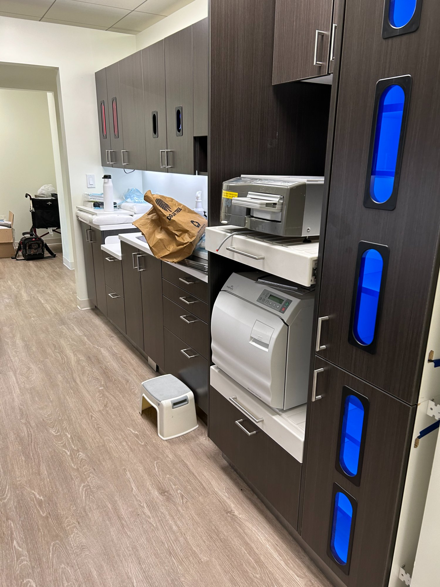 Sterilization center with autoclaves, instrument storage, and UV cabinets in dental office