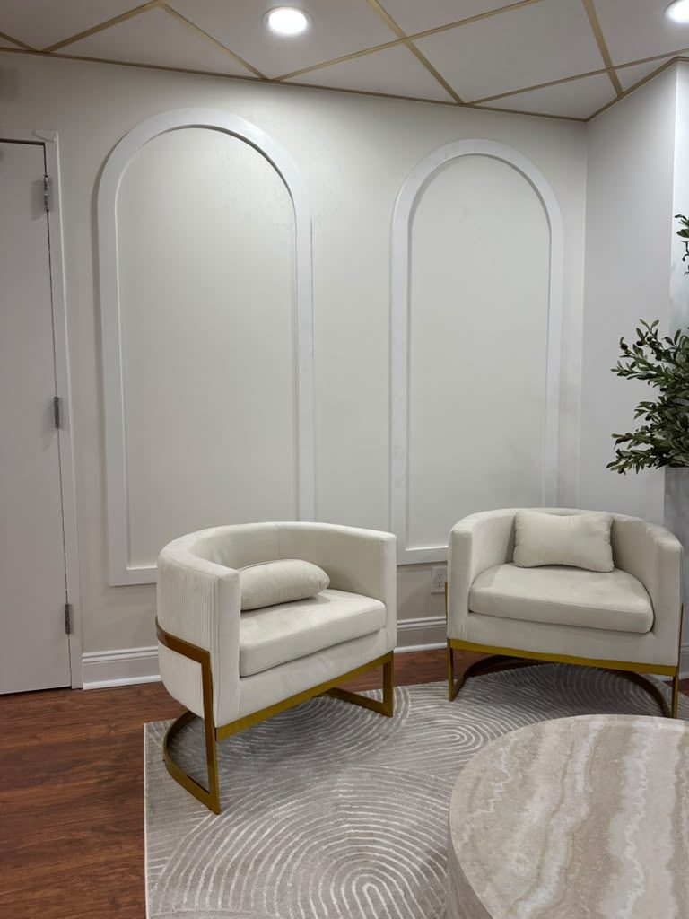 Navy accent wall with gold-trimmed arched panels in a Scarsdale NY dental office