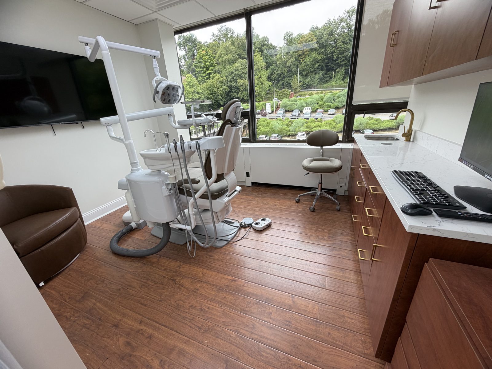 Dental operatory in Scarsdale NY with new quartz countertop, wood cabinetry and fresh paint